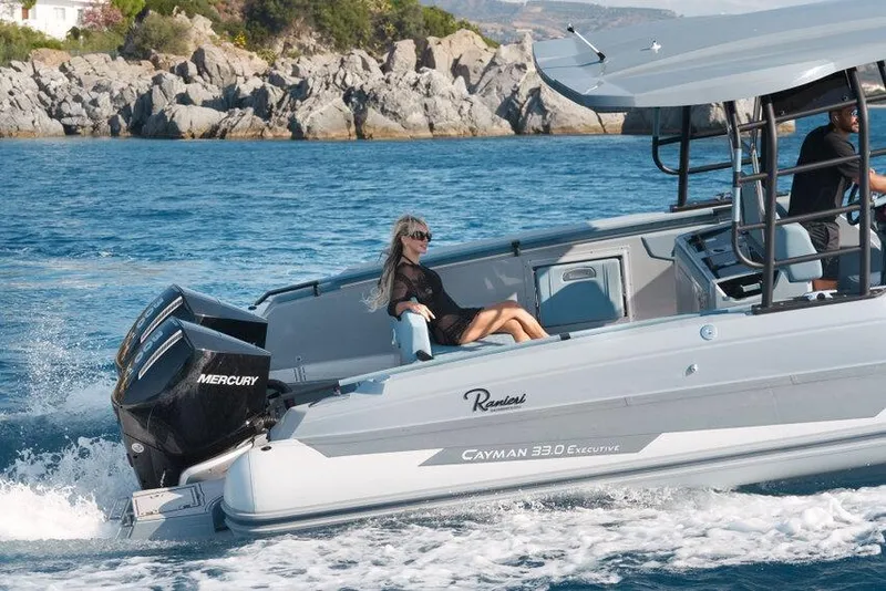 Slide: The Image of 2026 Ranieri CAYMAN 33.0 EXECUTIVE cruising on blue waters with passengers. - 41