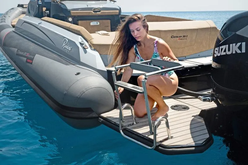 Slide: The Image of Woman on Ranieri CAYMAN 38.0 EXECUTIVE boat, 2026 model, near Suzuki engine. - 10