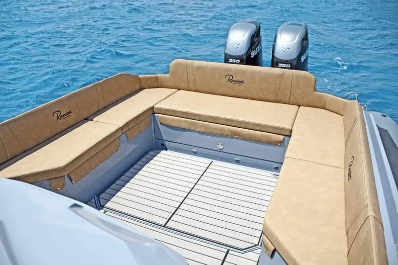 Slide: The Image of Luxurious seating on 2026 Ranieri CAYMAN 38.0 EXECUTIVE boat with twin engines, ocean backdrop. - 14