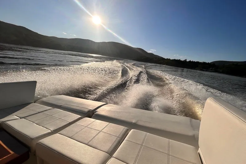Slide: The Image of 2015 Cruisers Yachts 390 Express Coupe cruising on a sunny day, leaving a wake. - 12