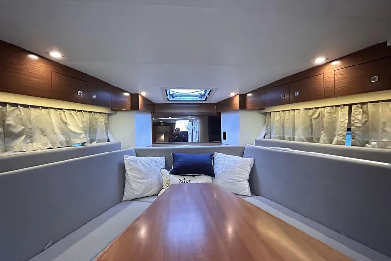 Slide: The Image of Luxurious interior of 2015 Cruisers Yachts 390 Express Coupe with elegant seating and wooden accents. - 21