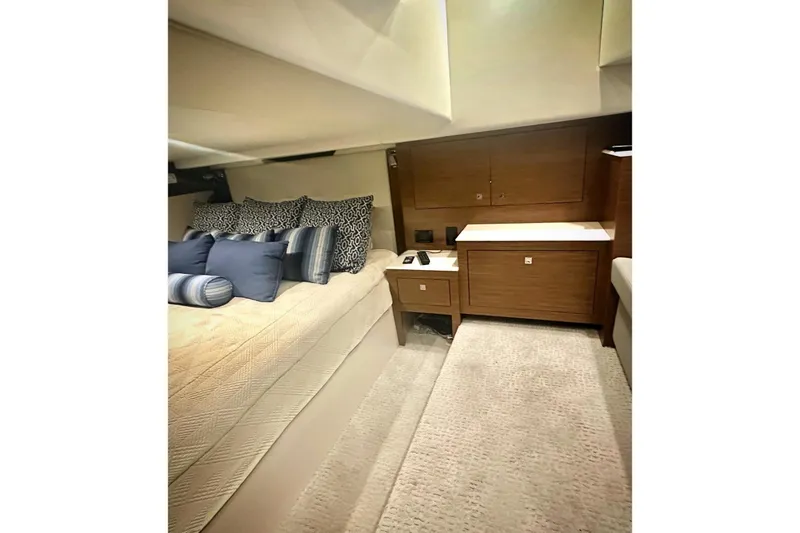 Slide: The Image of Luxurious interior cabin of 2015 Cruisers Yachts 390 Express Coupe with plush bedding. - 22