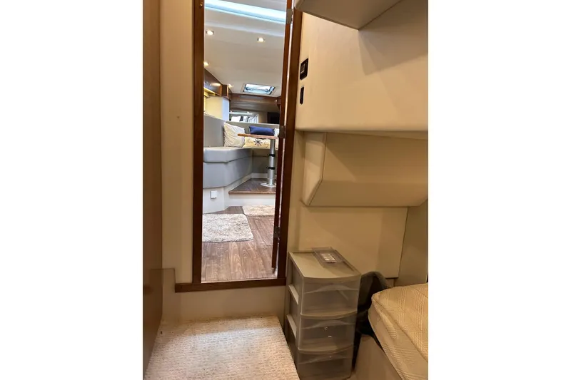 Slide: The Image of Interior view of 2015 Cruisers Yachts 390 Express Coupe, featuring cozy seating and modern design. - 25