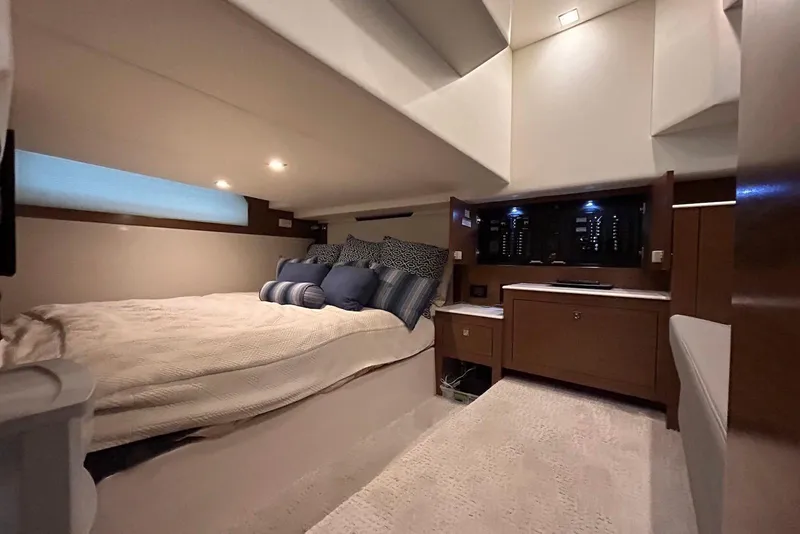 Slide: The Image of Luxurious cabin interior of 2015 Cruisers Yachts 390 Express Coupe with cozy bedding. - 32