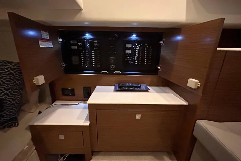 Slide: The Image of 2015 Cruisers Yachts 390 Express Coupe interior with open electrical panel. - 34