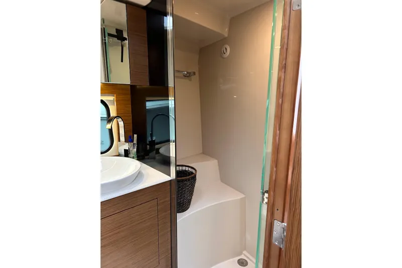 Slide: The Image of Bathroom interior of 2015 Cruisers Yachts 390 Express Coupe with modern fixtures. - 35