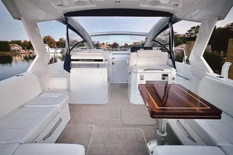 Slide: The Image of Luxurious interior of 2015 Cruisers Yachts 390 Express Coupe with elegant seating and table. - 4