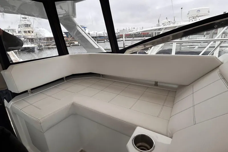 Slide: The Image of Luxurious seating area on 2015 Cruisers Yachts 390 Express Coupe, docked at marina. - 6