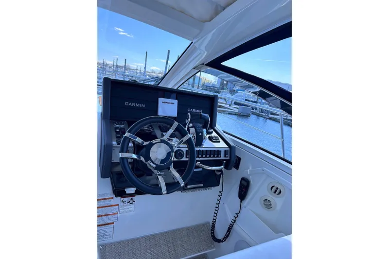 Slide: The Image of Helm of 2015 Cruisers Yachts 390 Express Coupe with Garmin navigation system. - 9