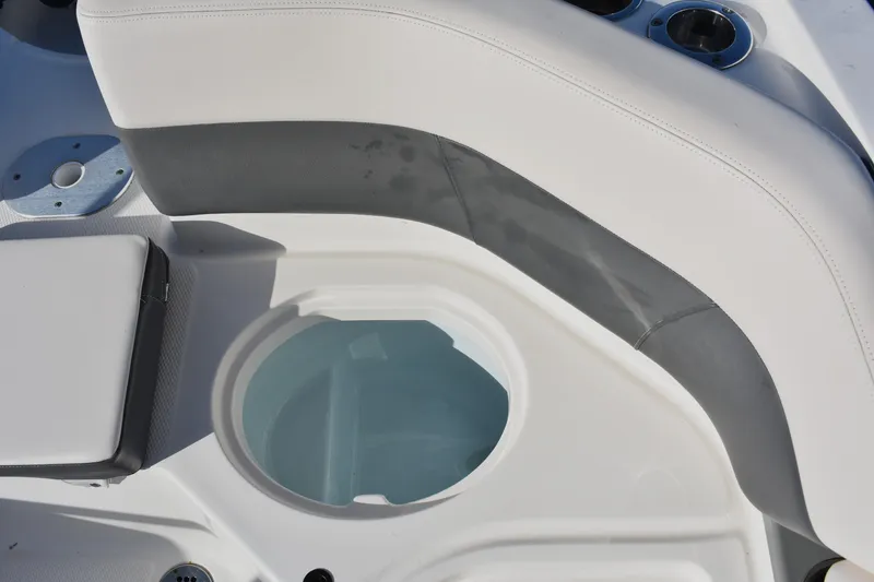 Slide: The Image of 2017 Chaparral 230 Suncoast boat interior with seating and storage compartment. - 12