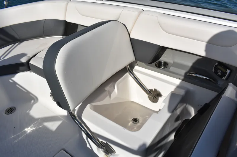Slide: The Image of 2017 Chaparral 230 Suncoast boat interior seating with storage compartment. - 17