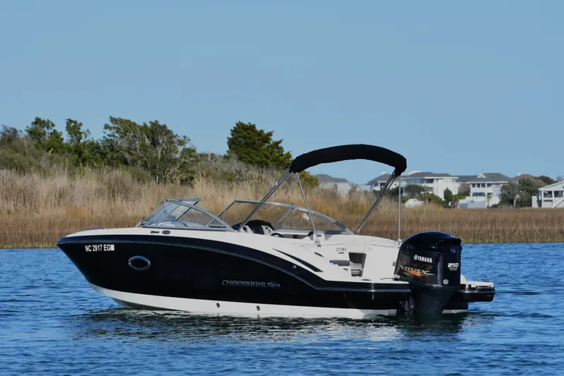Slide: The Image of 2017 Chaparral 230 Suncoast boat on water with Yamaha outboard motor. - 4
