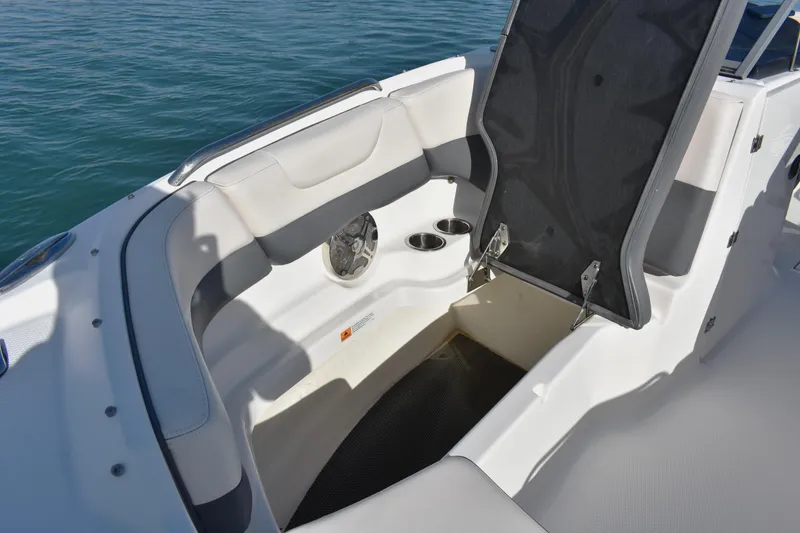 Slide: The Image of 2017 Chaparral 230 Suncoast boat interior with seating and storage compartment. - 6