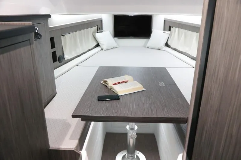 Slide: The Image of Luxurious interior of 2026 Ranieri Cayman 45.0 Executive yacht with table and seating area. - 13