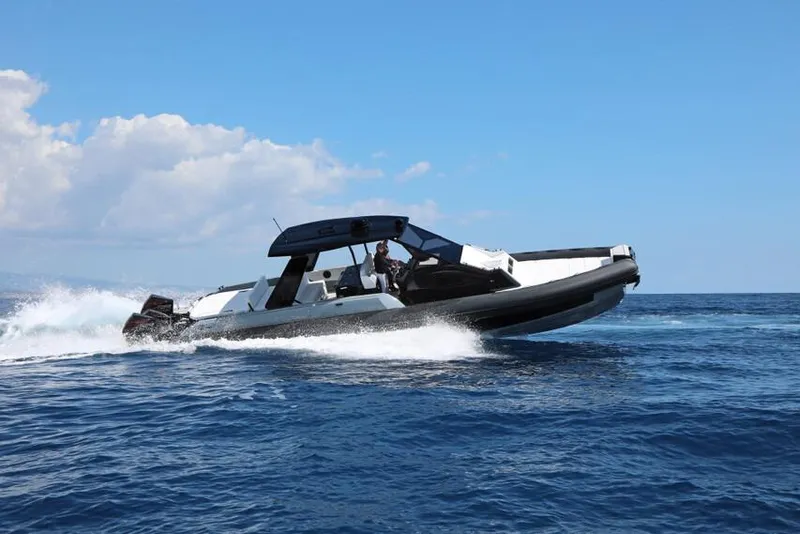 Slide: The Image of 2026 Ranieri Cayman 45.0 Executive cruising on open sea under clear blue sky. - 4
