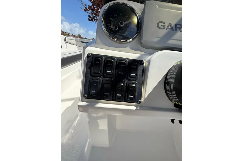 Slide: The Image of Control panel of 2023 Hurricane SunDeck Sport 205 OB boat with switches and gauge. - 15