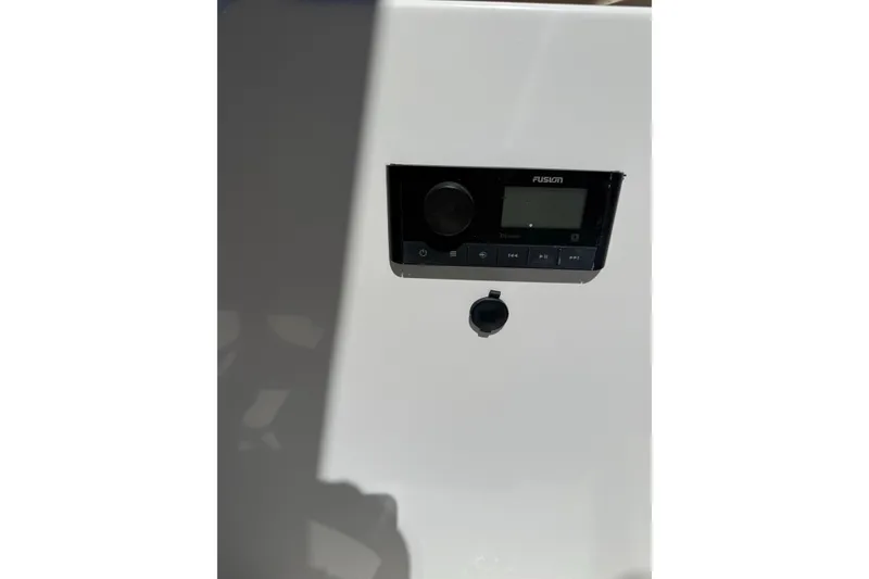 Slide: The Image of 2023 Hurricane SunDeck Sport 205 OB stereo system with control panel. - 19