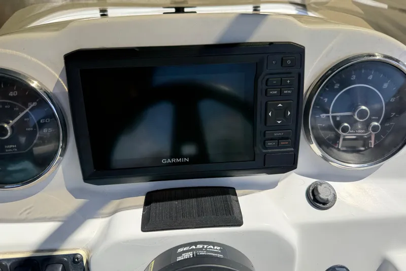 Slide: The Image of Dashboard of 2023 Hurricane SunDeck Sport 205 OB with Garmin display and gauges. - 21
