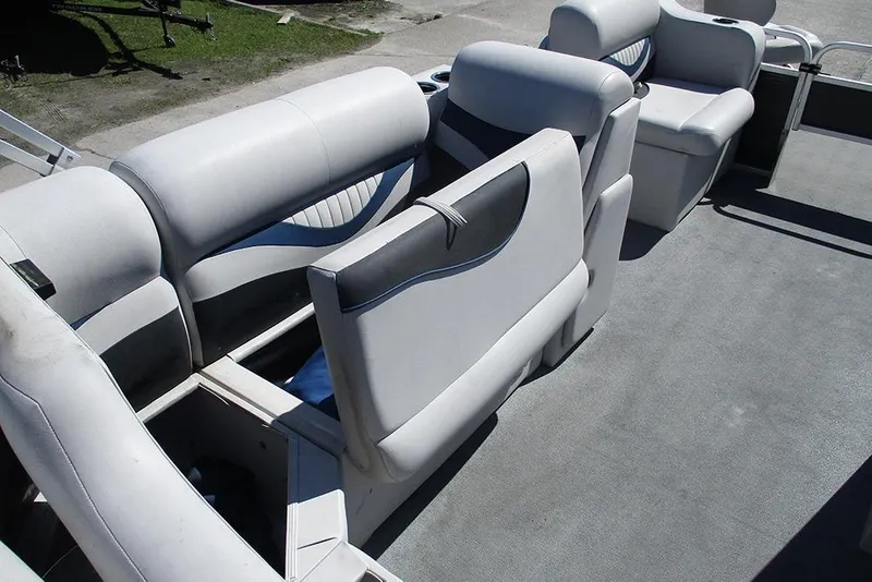 Slide: The Image of 2018 Apex Marine 820 Lanai Sport Cruise Adventure boat interior with gray seating and storage compartments. - 18