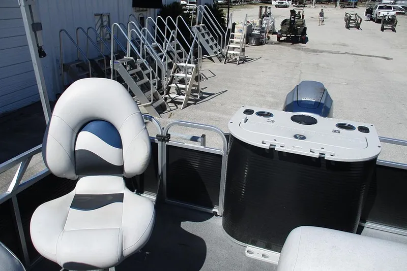 Slide: The Image of 2018 Apex Marine 820 Lanai Sport Cruise Adventure boat interior with seating and console. - 21