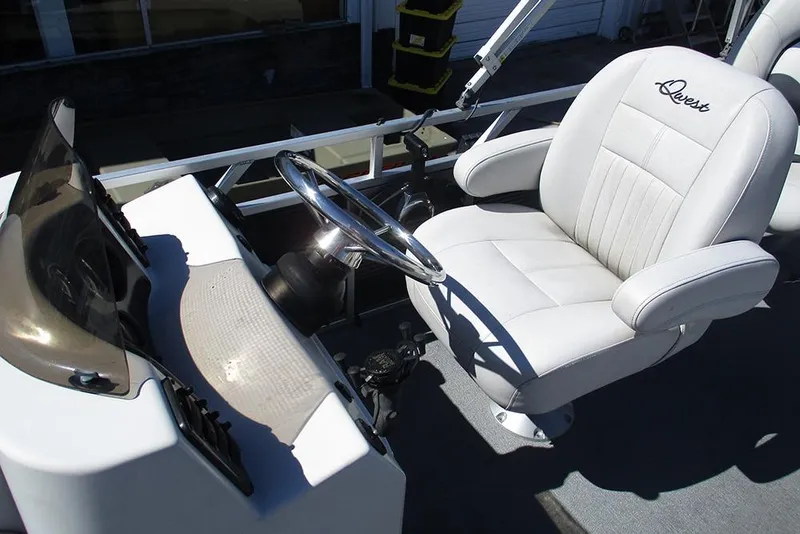 Slide: The Image of Captain's chair and helm of 2018 Apex Marine 820 Lanai Sport Cruise Adventure boat. - 23