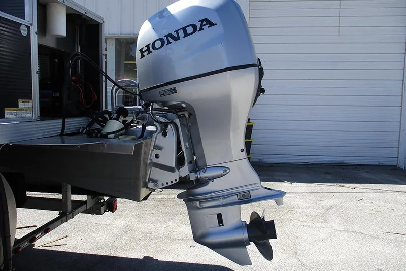 Slide: The Image of Silver Honda outboard motor on Apex Marine 820 Lanai Sport Cruise Adventure, 2018 model. - 9