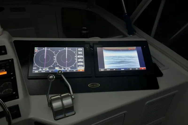 Slide: The Image of Cockpit of 1998 Ocean 53 Convertible with navigation and radar displays. - 12