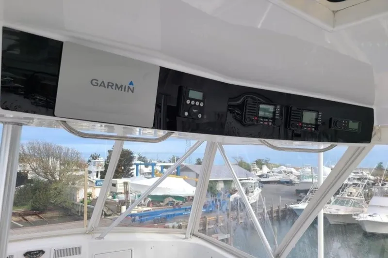 Slide: The Image of 1998 Ocean 53 Convertible yacht with Garmin navigation system, docked at marina. - 22