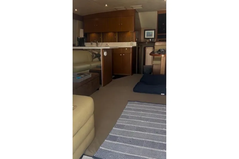 Slide: The Image of Interior of a 1998 Ocean 53 Convertible yacht with cozy seating and modern amenities. - 24