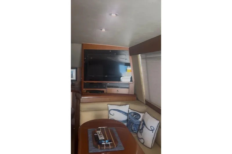 Slide: The Image of Interior of 1998 Ocean 53 Convertible yacht with TV and cozy seating area. - 28