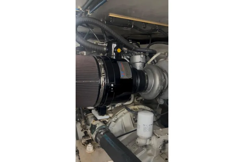 Slide: The Image of Engine compartment of a 1998 Ocean 53 Convertible yacht, showcasing mechanical components. - 37