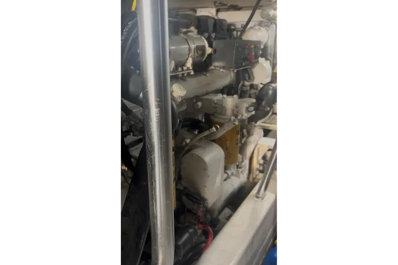 Slide: The Image of Engine compartment of a 1998 Ocean 53 Convertible yacht, showcasing mechanical components. - 42