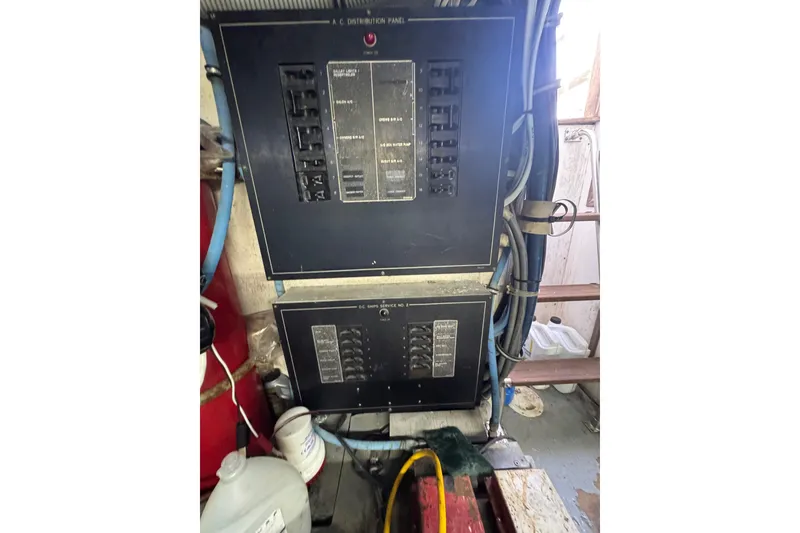 Slide: The Image of Electrical panels on a 1990 Hatteras 52 Convertible boat. - 23