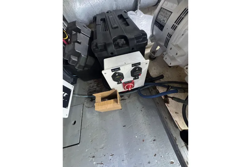 Slide: The Image of Engine room of 1990 Hatteras 52 Convertible with battery box and control panel. - 28