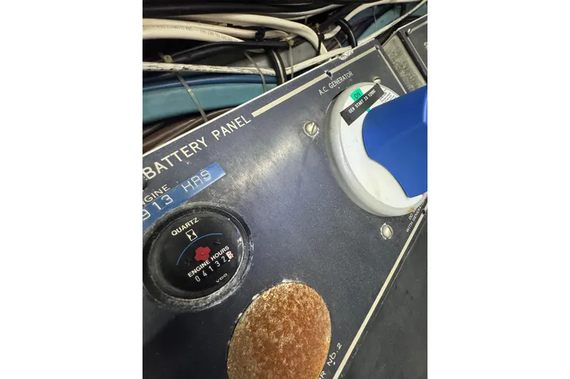 Slide: The Image of Battery panel of 1990 Hatteras 52 Convertible with engine hours display. - 32