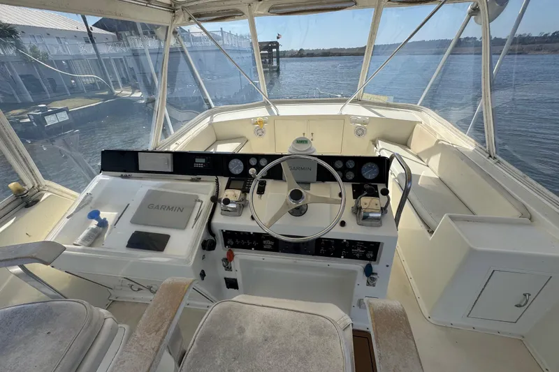 Slide: The Image of Cockpit of a 1990 Hatteras 52 Convertible yacht with Garmin navigation system. - 7