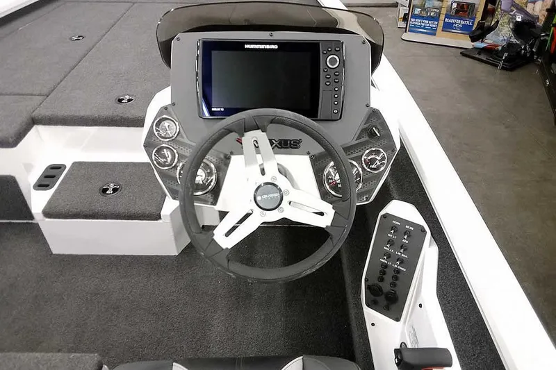 Slide: The Image of 2022 Vexus AVX1980 boat dashboard with steering wheel and electronic display. - 20