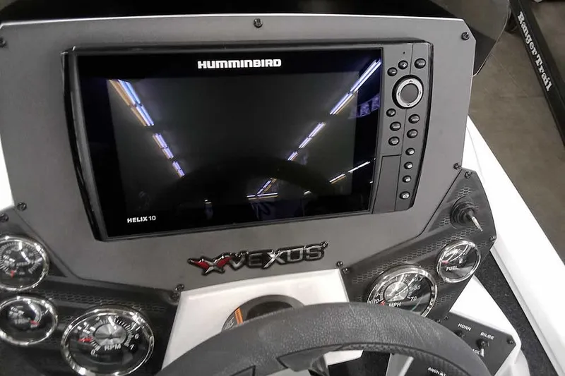 Slide: The Image of 2022 Vexus AVX1980 dashboard with Humminbird Helix 10 display and gauges. - 21