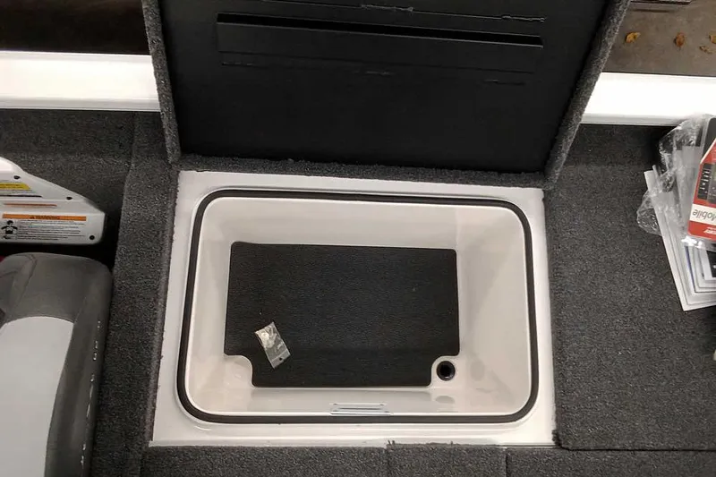 Slide: The Image of Open storage compartment in 2022 Vexus AVX1980 boat, featuring carpeted interior. - 22