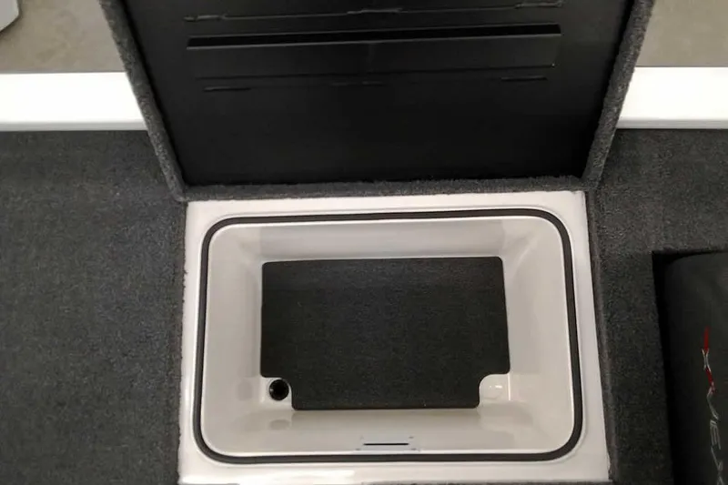 Slide: The Image of Open storage compartment in 2022 Vexus AVX1980 boat, featuring carpeted interior. - 24