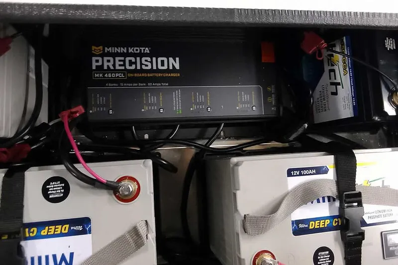 Slide: The Image of Minn Kota Precision battery charger and deep cycle batteries in 2022 Vexus AVX1980 boat. - 26