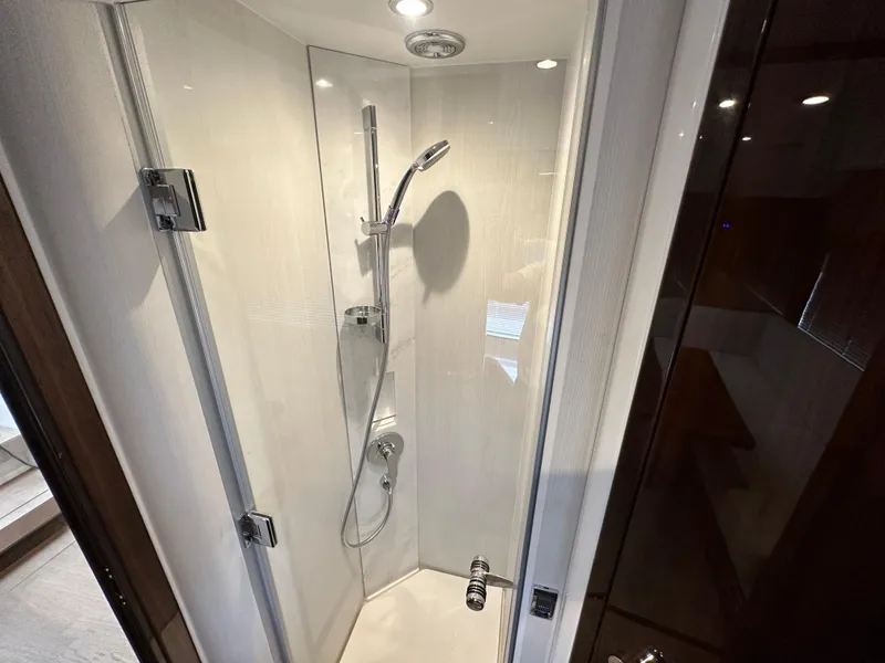 Slide: The Image of 2024 Fairline Targa 45 GT yacht shower cabin with modern fixtures and lighting. - 11