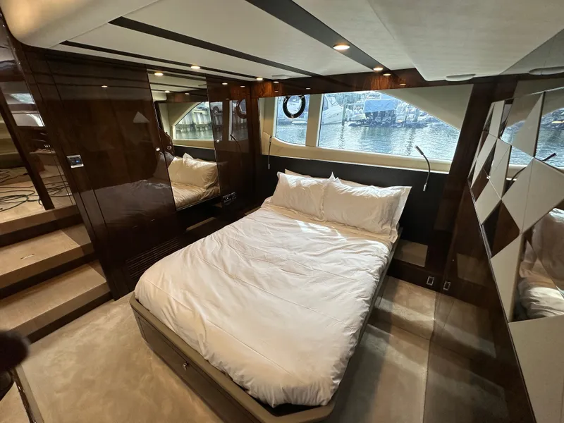 Slide: The Image of Luxurious bedroom interior of 2024 Fairline Targa 45 GT yacht with large bed and window view. - 19