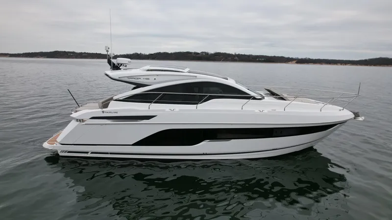 Slide: The Image of 2024 Fairline Targa 45 GT luxury yacht on calm waters. - 2