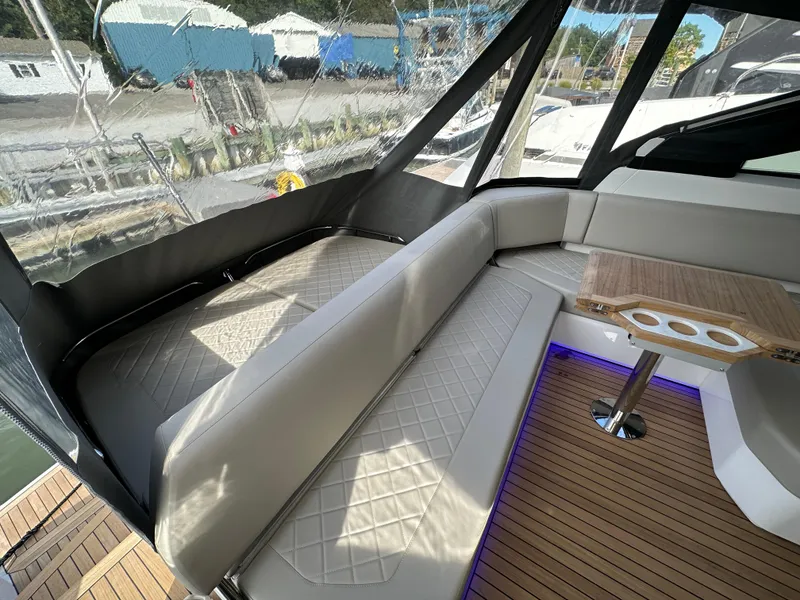 Slide: The Image of Interior seating area of the 2024 Fairline Targa 45 GT yacht with wooden table. - 27
