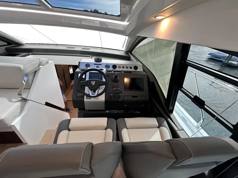 Slide: The Image of Interior helm of 2024 Fairline Targa 45 GT yacht with modern controls and seating. - 33