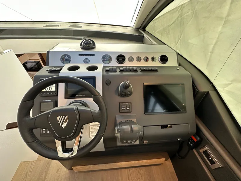 Slide: The Image of Fairline Targa 45 GT 2024 helm station with modern controls and navigation screens. - 35