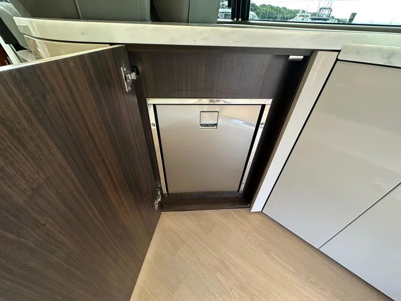 Slide: The Image of Open cabinet in the 2024 Fairline Targa 45 GT yacht kitchen. - 37