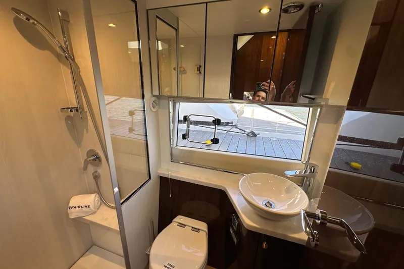 Slide: The Image of Luxurious interior of 2024 Fairline Targa 45 GT yacht with elegant wood finishes. - 41