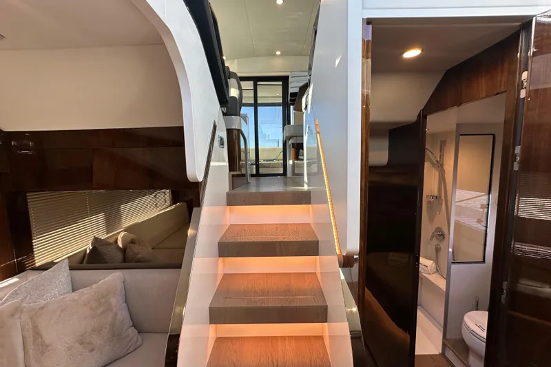 Slide: The Image of Luxurious interior of 2024 Fairline Targa 45 GT yacht with elegant wood finishes and cozy seating. - 49